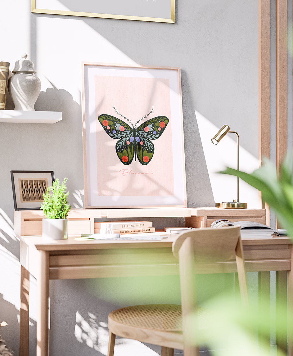 Decorative butterfly illustration with floral details displayed as wall art by Tawn Moore